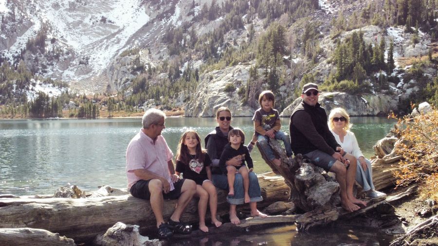 Giusseppe with family at a mountain lake